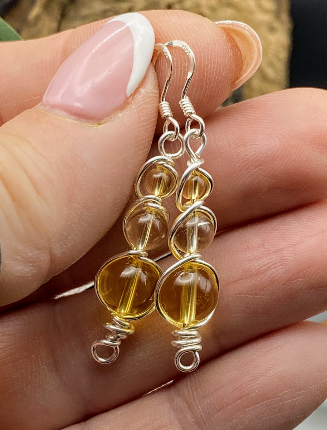 Handmade citrine earrings wrapped in silver healing crystal jewellery with golden warmth