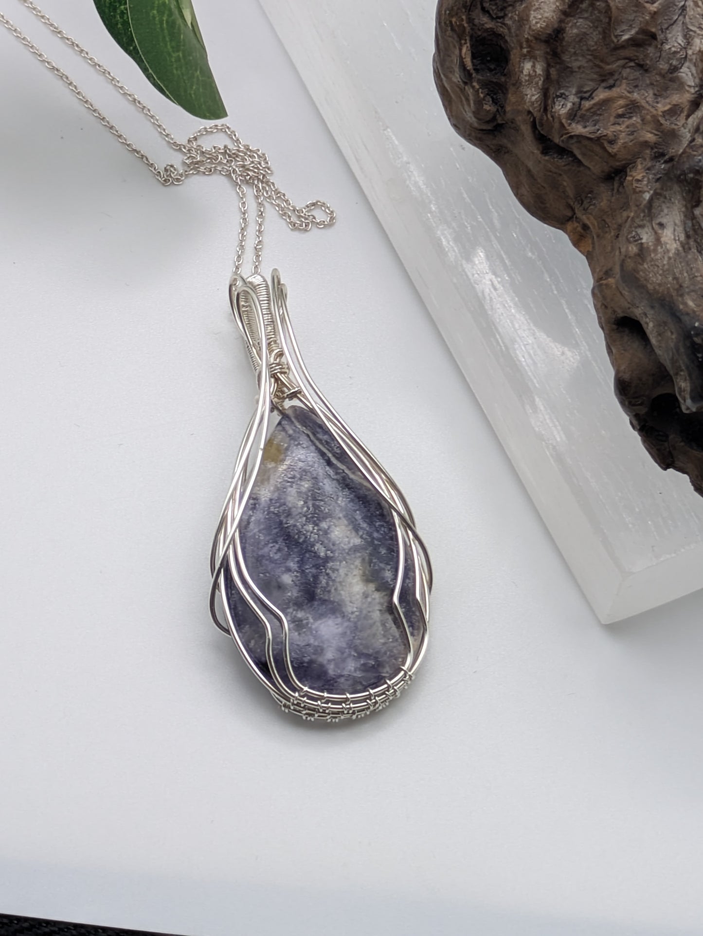 Handcrafted Tiffany Jasper pendant wrapped in sterling silver wire, showcasing earthy purple, cream and brown tones. A nature-inspired design symbolizing emotional balance, grounding energy, and inner strength.