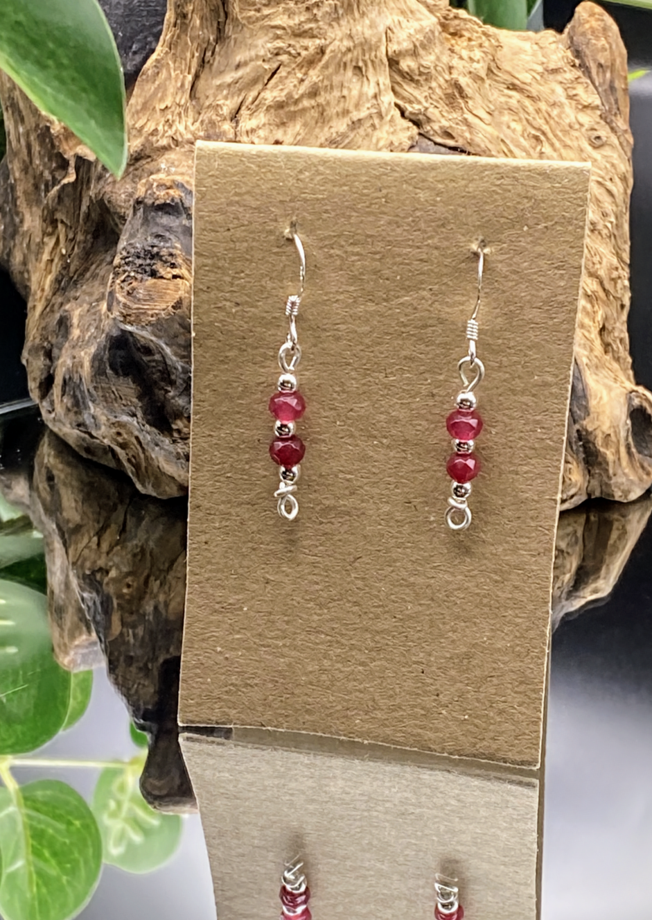 html
<img src="ruby-earrings.jpg" alt="Dainty ruby red gemstone earrings handcrafted in sterling silver, delicate crystal drops for passion and elegance">