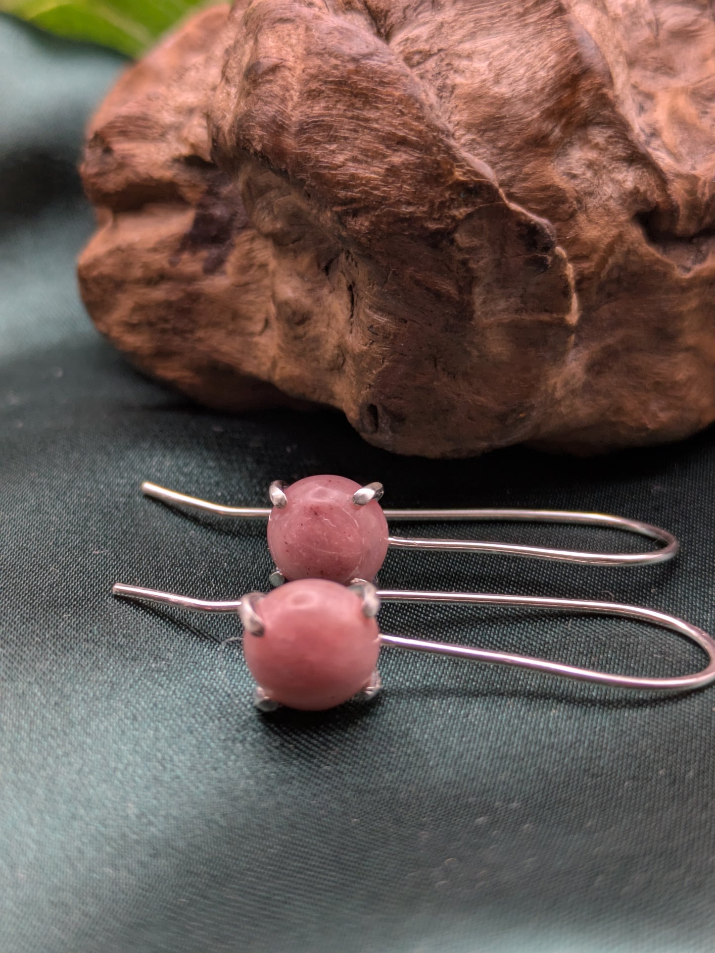 <img src="rhodonite-earrings.jpg" alt="Handmade rhodonite earrings in recycled sterling silver, pink crystal drops for emotional healing and self-love">