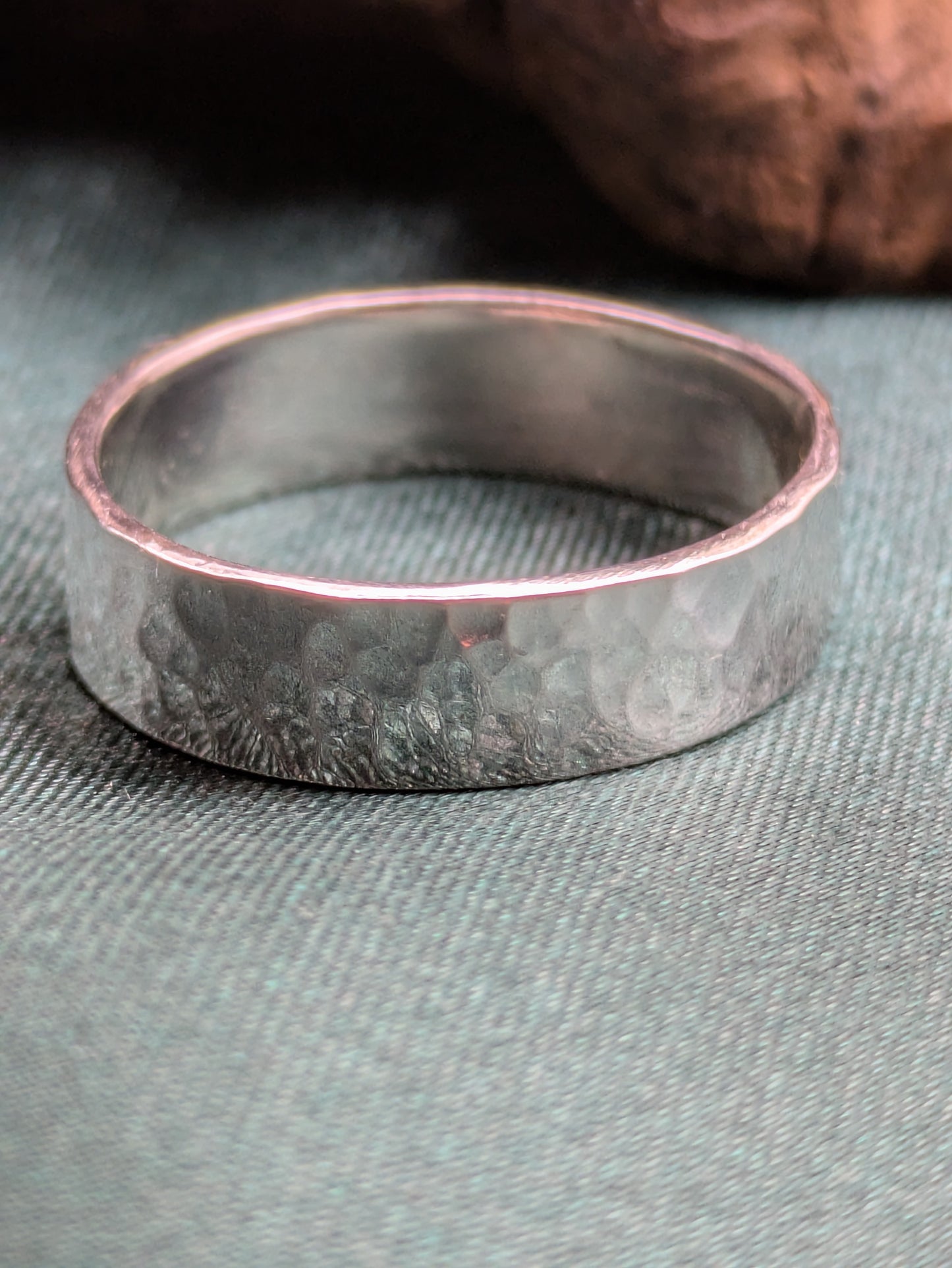 <img src="hammered-silver-ring.jpg" alt="Handcrafted 6mm sterling silver ring with hammered texture, a bold and unique statement band made from recycled 925 silver">