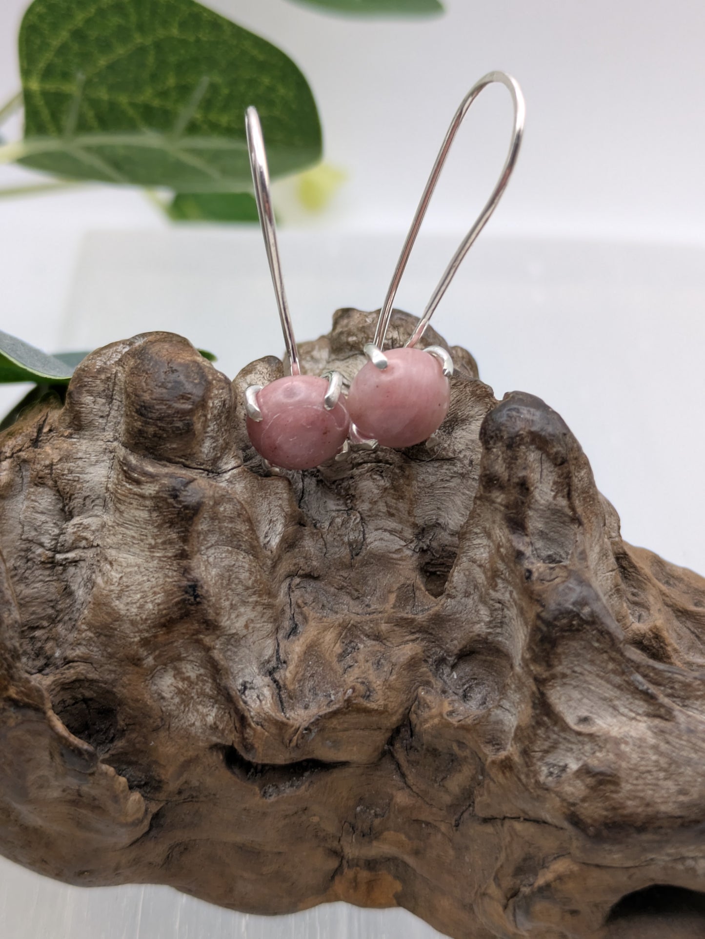 <img src="rhodonite-earrings.jpg" alt="Handmade rhodonite earrings in recycled sterling silver, pink crystal drops for emotional healing and self-love">