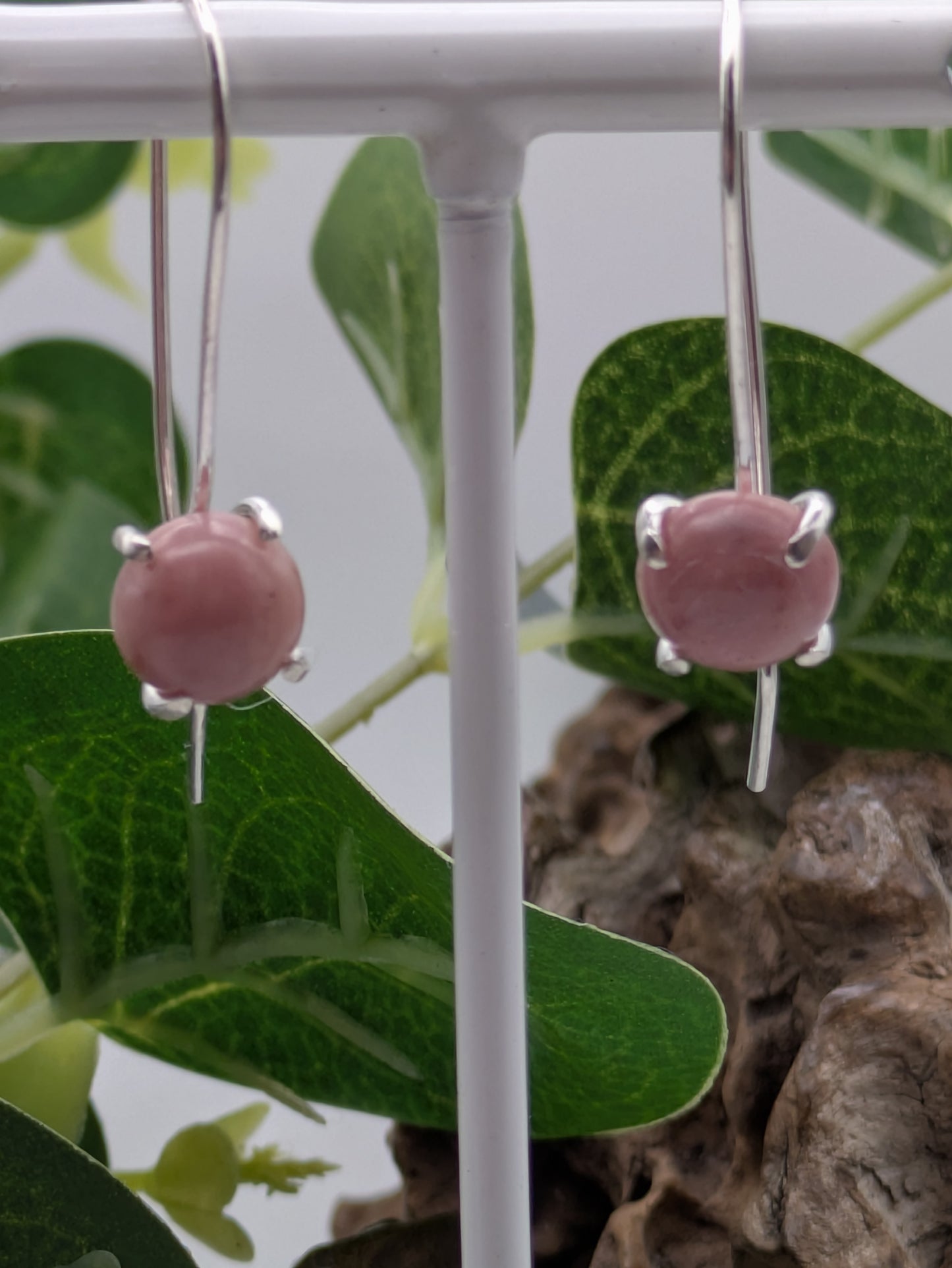 <img src="rhodonite-earrings.jpg" alt="Handmade rhodonite earrings in recycled sterling silver, pink crystal drops for emotional healing and self-love">
