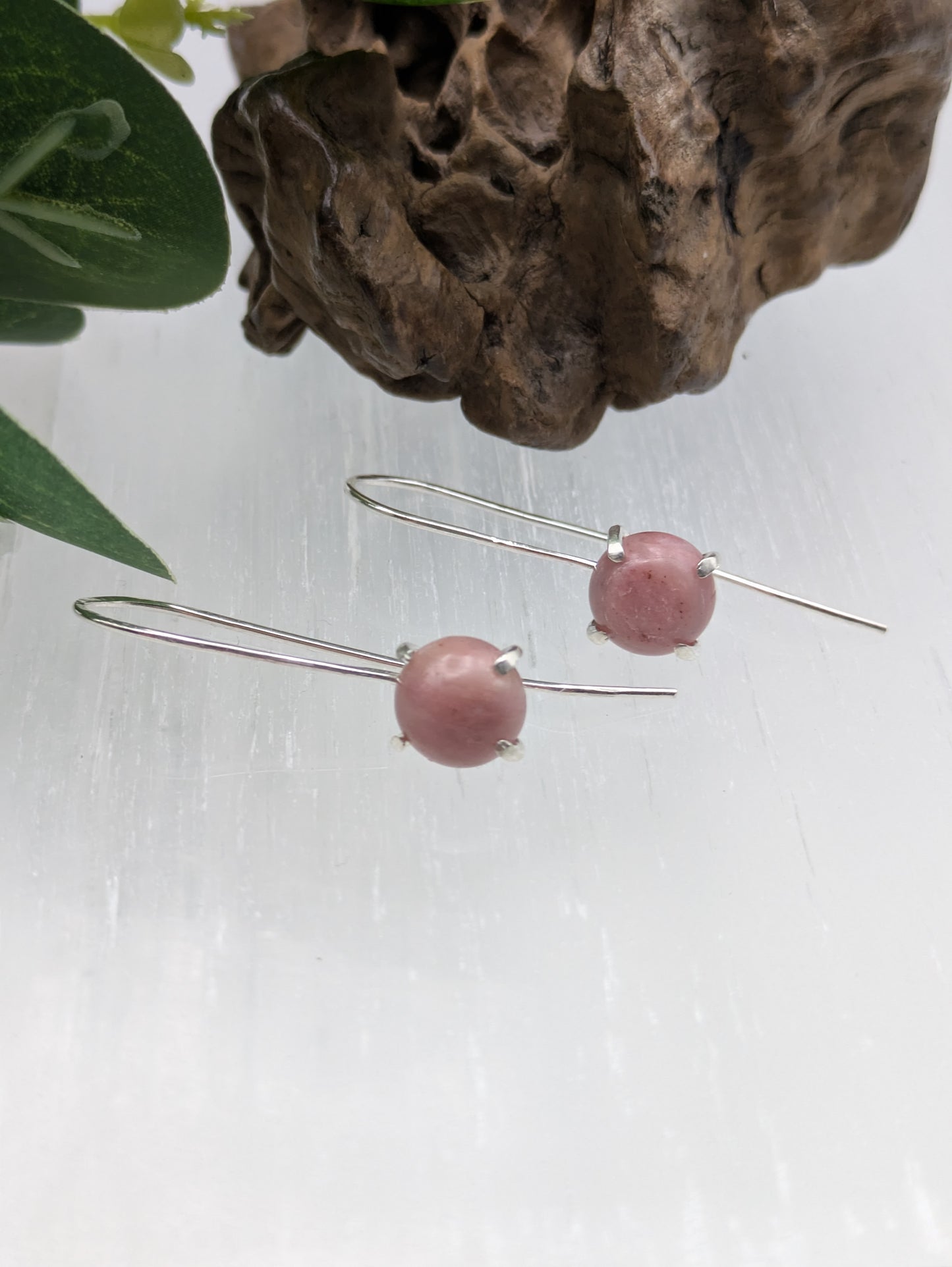 <img src="rhodonite-earrings.jpg" alt="Handmade rhodonite earrings in recycled sterling silver, pink crystal drops for emotional healing and self-love">