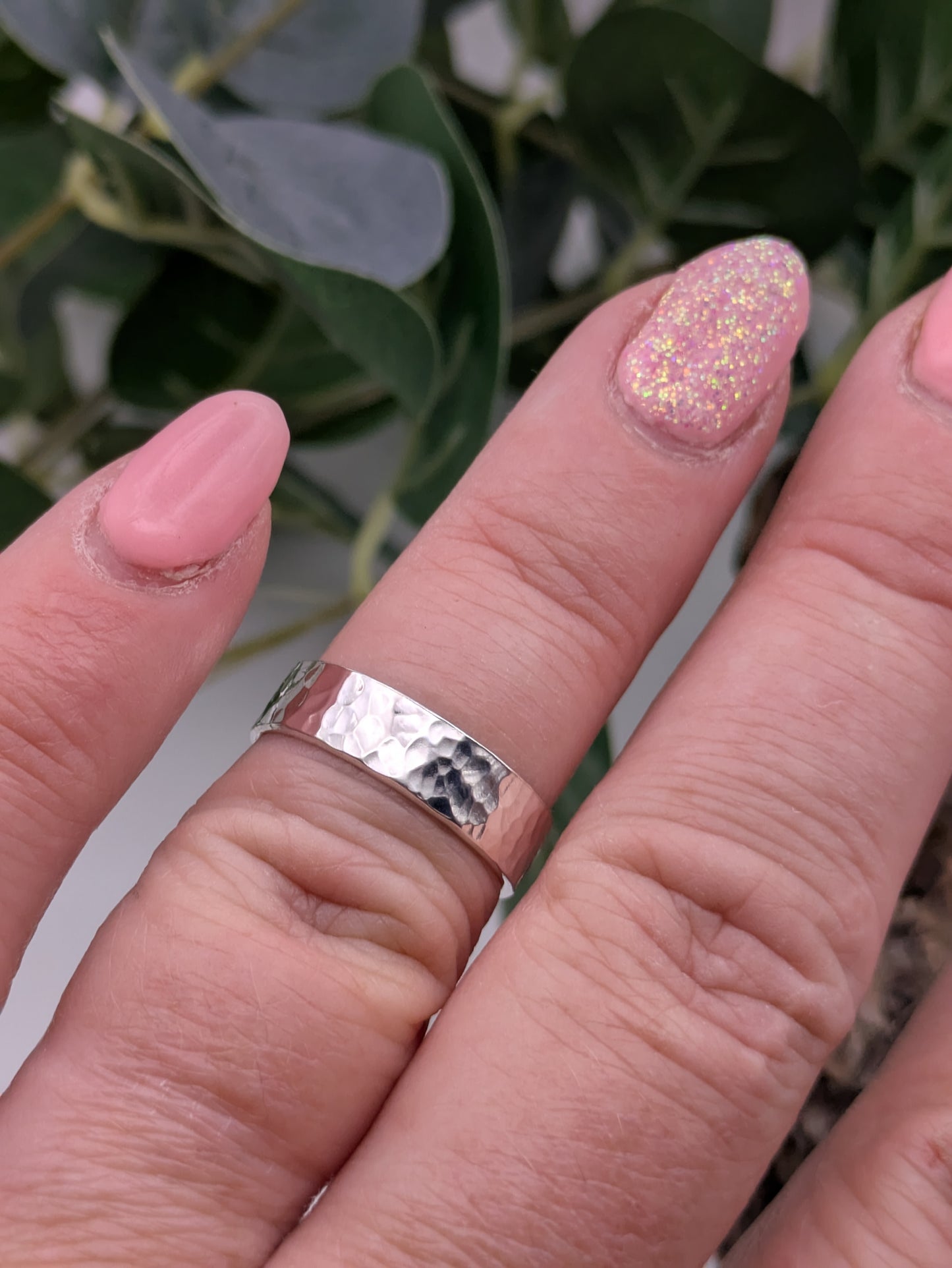 <img src="hammered-silver-ring.jpg" alt="Handcrafted 6mm sterling silver ring with hammered texture, a bold and unique statement band made from recycled 925 silver">