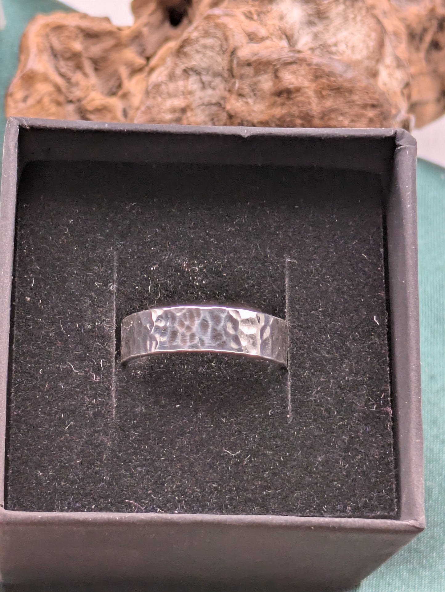 <img src="hammered-silver-ring.jpg" alt="Handcrafted 6mm sterling silver ring with hammered texture, a bold and unique statement band made from recycled 925 silver">