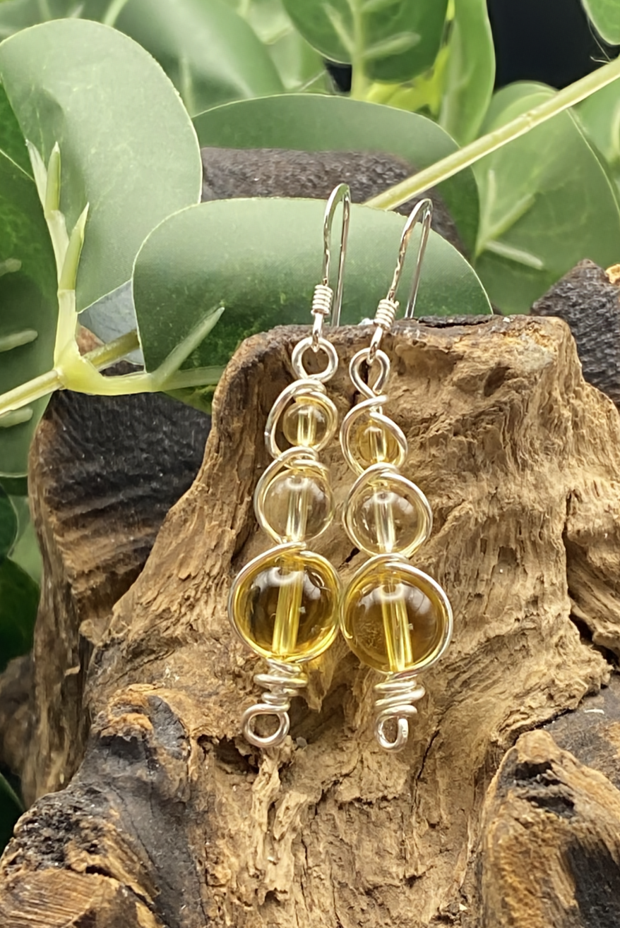 Handmade citrine earrings wrapped in silver healing crystal jewellery with golden warmth