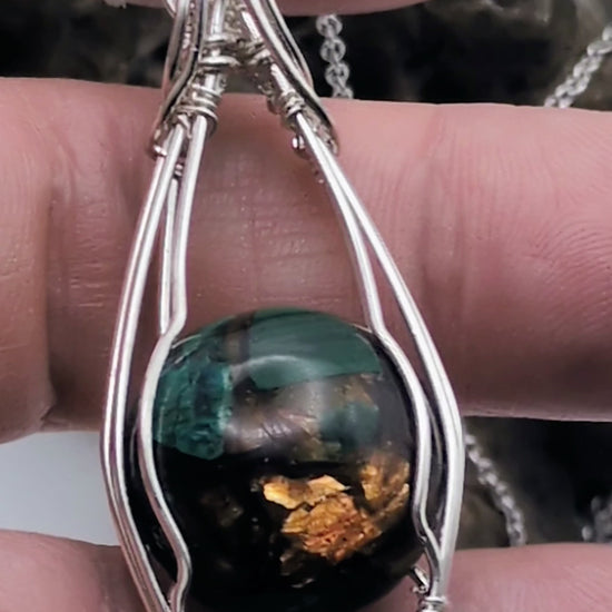 Video of Copper Bornite handmade Sterling silver necklace, showing the beautiful peacock, blues and greens offset by the copper in the gemstone.