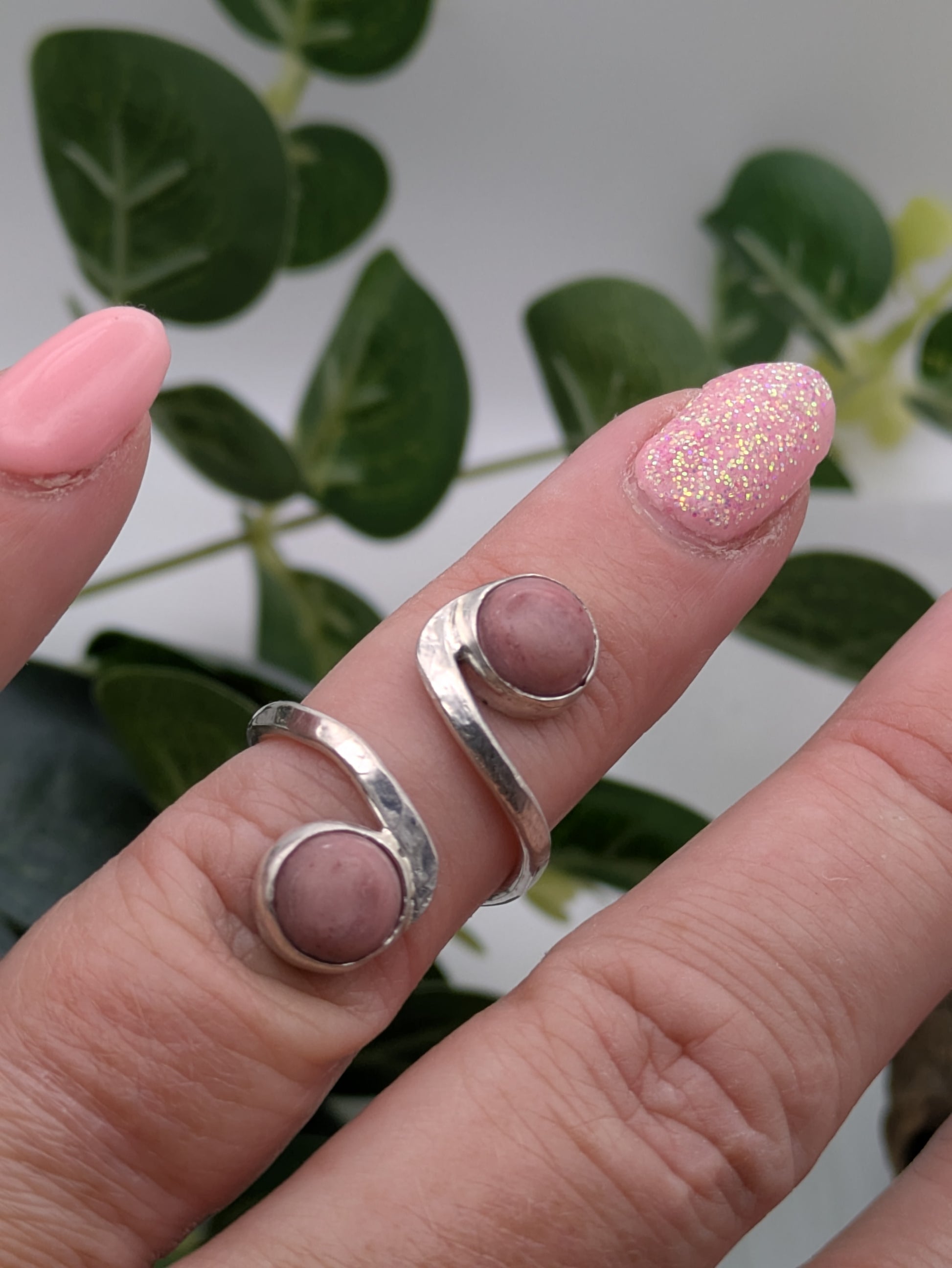 <img src="rhodonite-ring.jpg" alt="Handmade rhodonite ring in recycled sterling silver with hammered texture, a natural pink gemstone piece for emotional balance and self-love">