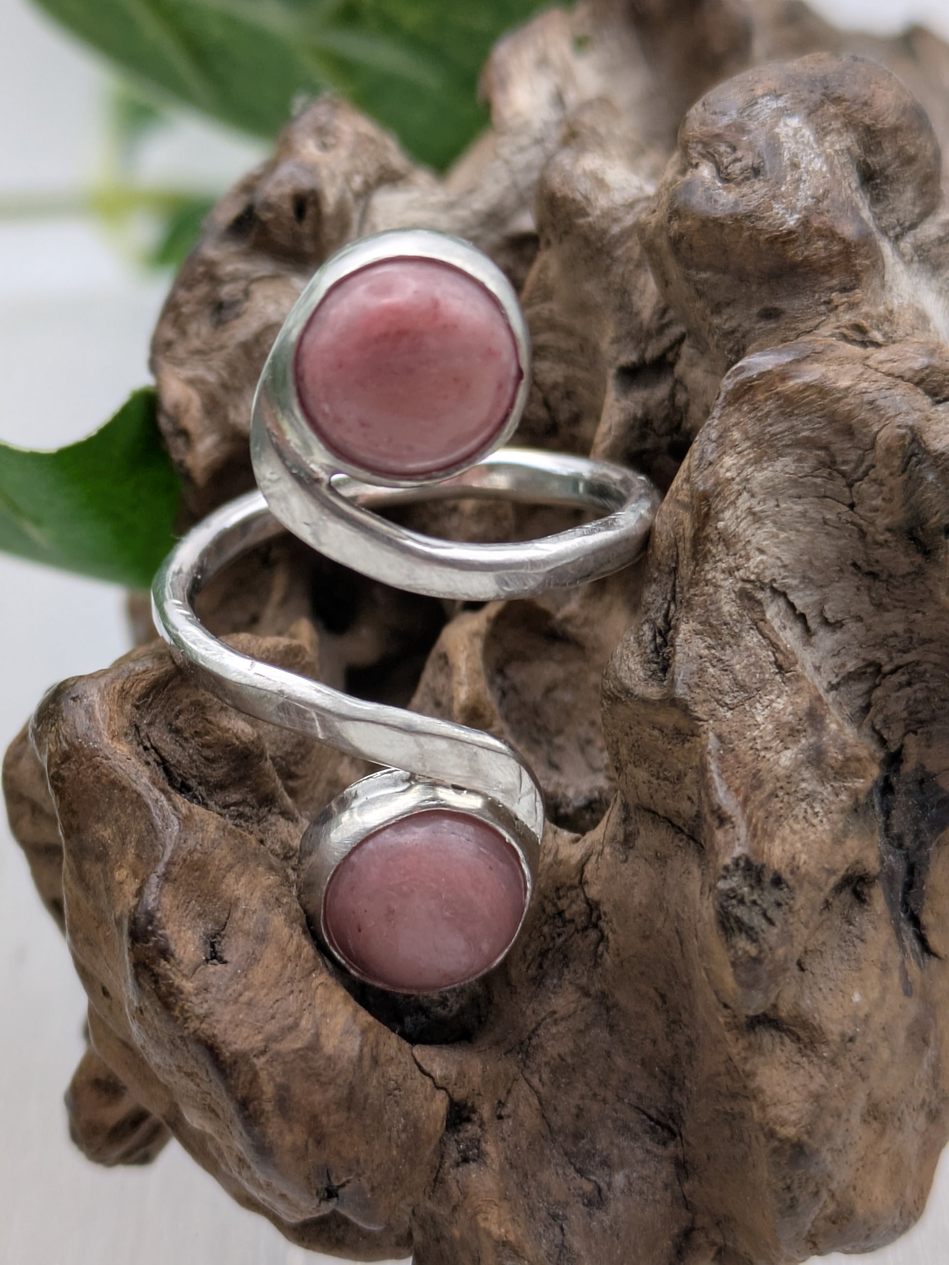 <img src="rhodonite-ring.jpg" alt="Handmade rhodonite ring in recycled sterling silver with hammered texture, a natural pink gemstone piece for emotional balance and self-love">