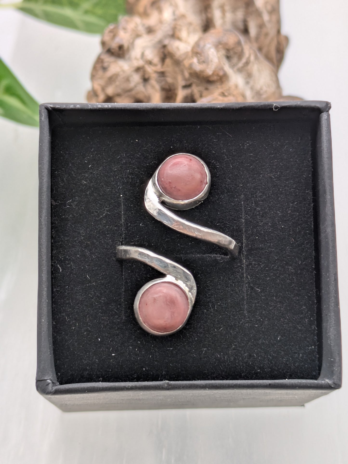 <img src="rhodonite-ring.jpg" alt="Handmade rhodonite ring in recycled sterling silver with hammered texture, a natural pink gemstone piece for emotional balance and self-love">