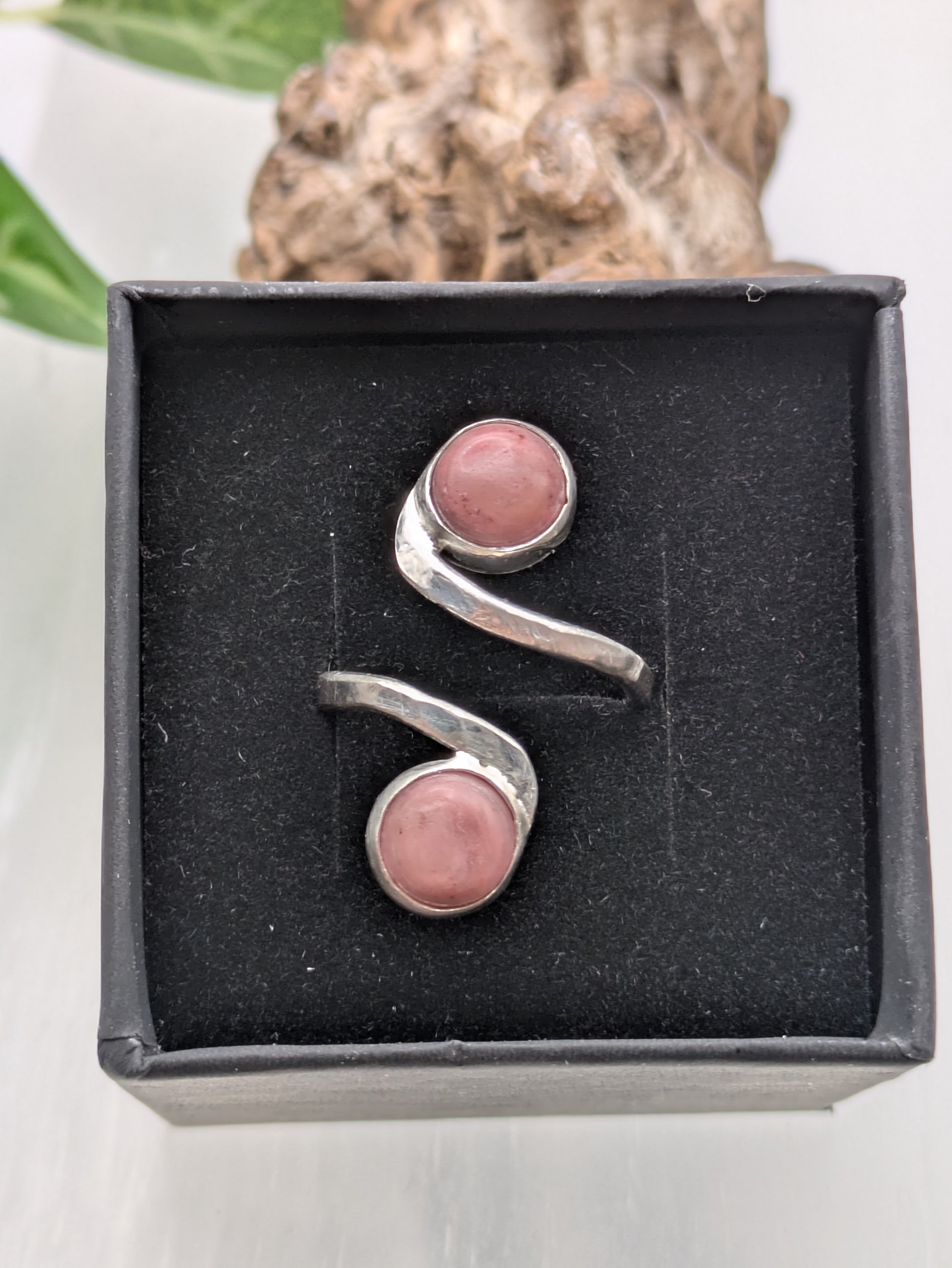<img src="rhodonite-ring.jpg" alt="Handmade rhodonite ring in recycled sterling silver with hammered texture, a natural pink gemstone piece for emotional balance and self-love">