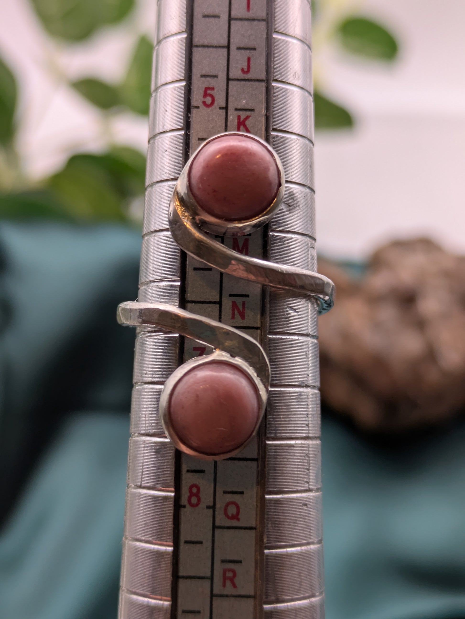 <img src="rhodonite-ring.jpg" alt="Handmade rhodonite ring in recycled sterling silver with hammered texture, a natural pink gemstone piece for emotional balance and self-love">