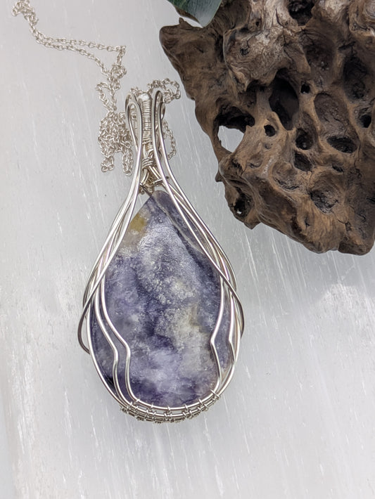 Handcrafted Tiffany Jasper pendant wrapped in sterling silver wire, showcasing earthy purple, cream and brown tones. A nature-inspired design symbolizing emotional balance, grounding energy, and inner strength.