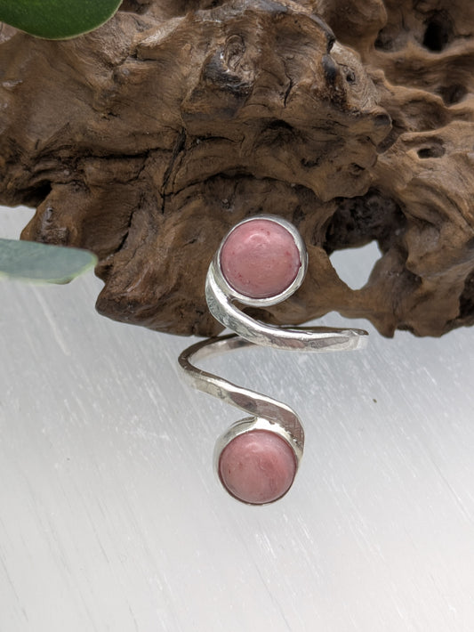 <img src="rhodonite-ring.jpg" alt="Handmade rhodonite ring in recycled sterling silver with hammered texture, a natural pink gemstone piece for emotional balance and self-love">