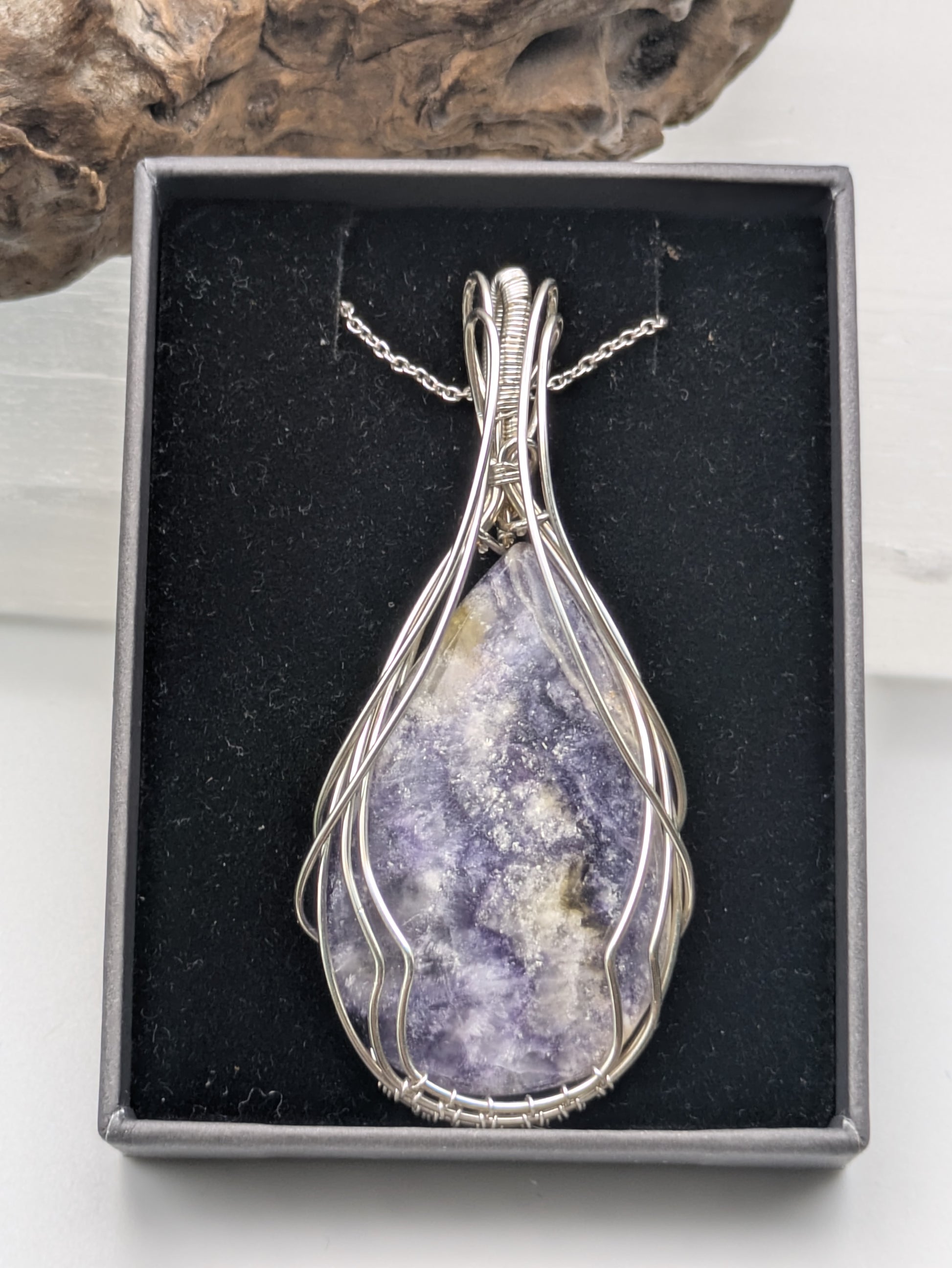 Handcrafted Tiffany Jasper pendant wrapped in sterling silver wire, showcasing earthy purple, cream and brown tones. A nature-inspired design symbolizing emotional balance, grounding energy, and inner strength.