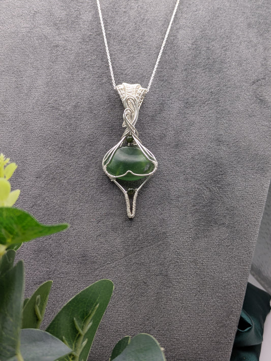 <img src="indonesian-jade-pendant.jpg" alt="Handmade Indonesian jade pendant wrapped in recycled sterling silver, a unique statement crystal necklace inspired by nature">