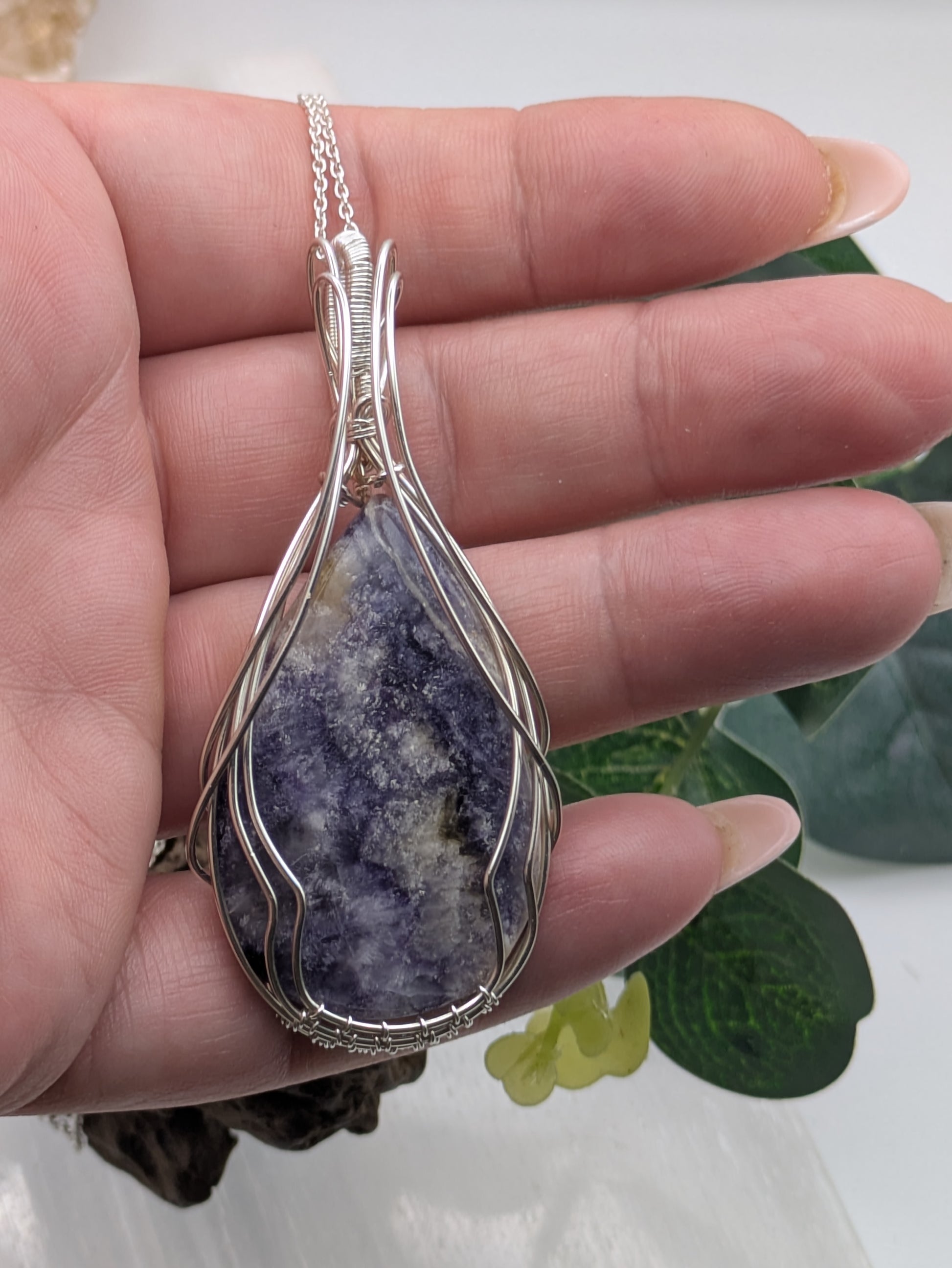 Handcrafted Tiffany Jasper pendant wrapped in sterling silver wire, showcasing earthy purple, cream and brown tones. A nature-inspired design symbolizing emotional balance, grounding energy, and inner strength. Beautiful statement piece.