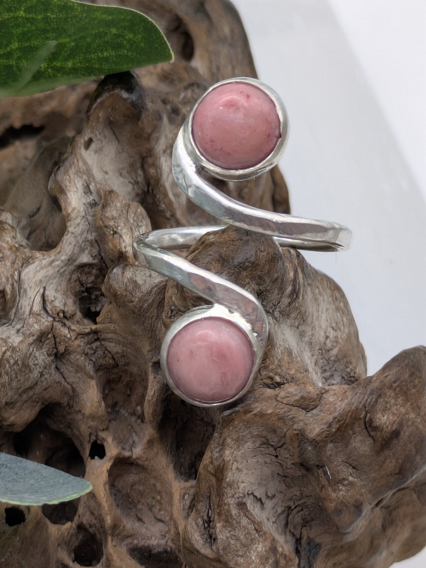 <img src="rhodonite-ring.jpg" alt="Handmade rhodonite ring in recycled sterling silver with hammered texture, a natural pink gemstone piece for emotional balance and self-love">