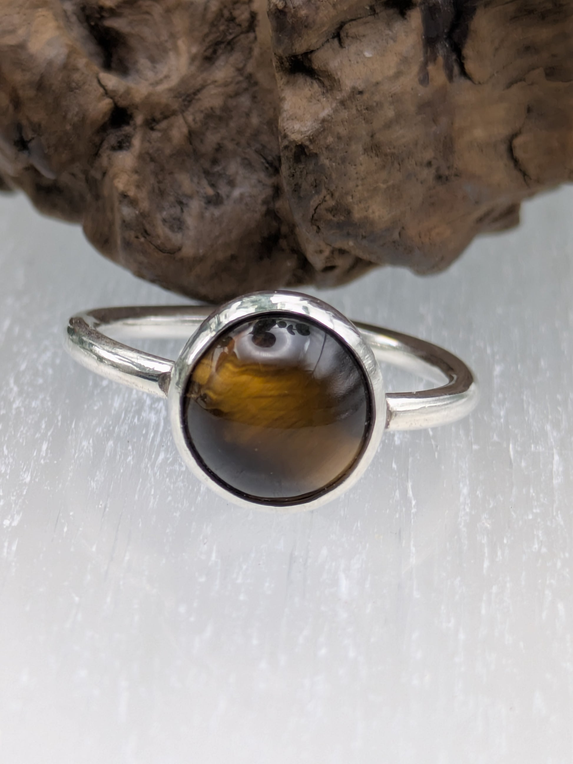 <img src="tigers-eye-ring.jpg" alt="Handmade Tiger's Eye ring in recycled sterling silver, UK size R, a bold crystal healing statement piece for strength and grounding">