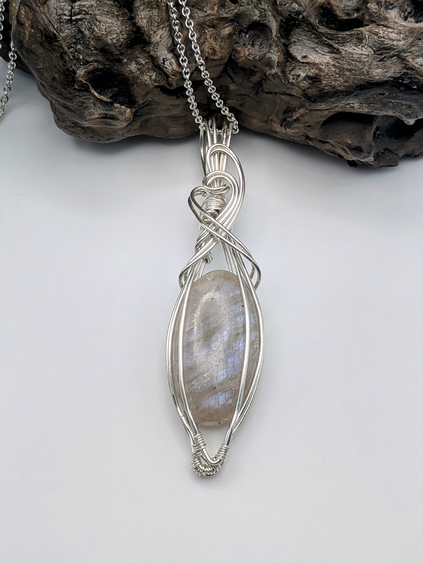 Moonlit belomorite pendant wrapped in recycled silver—evoking summer skies and twilight gardens
