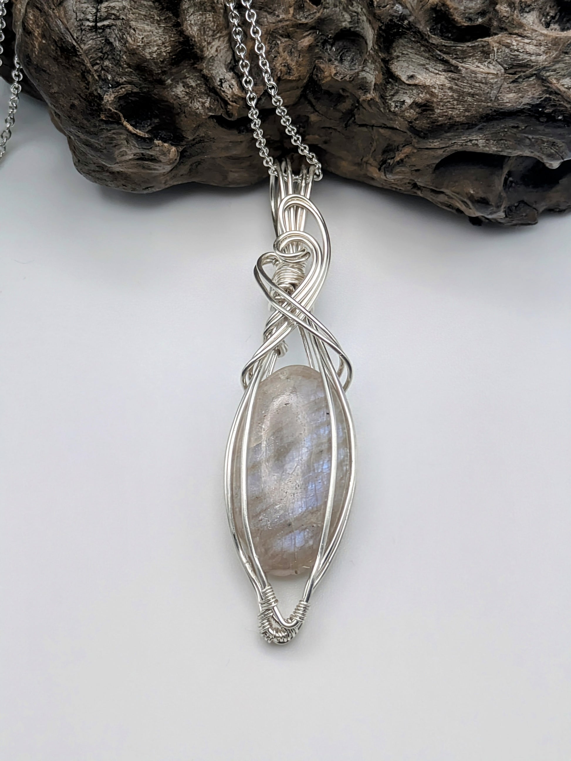 Moonlit belomorite pendant wrapped in recycled silver—evoking summer skies and twilight gardens