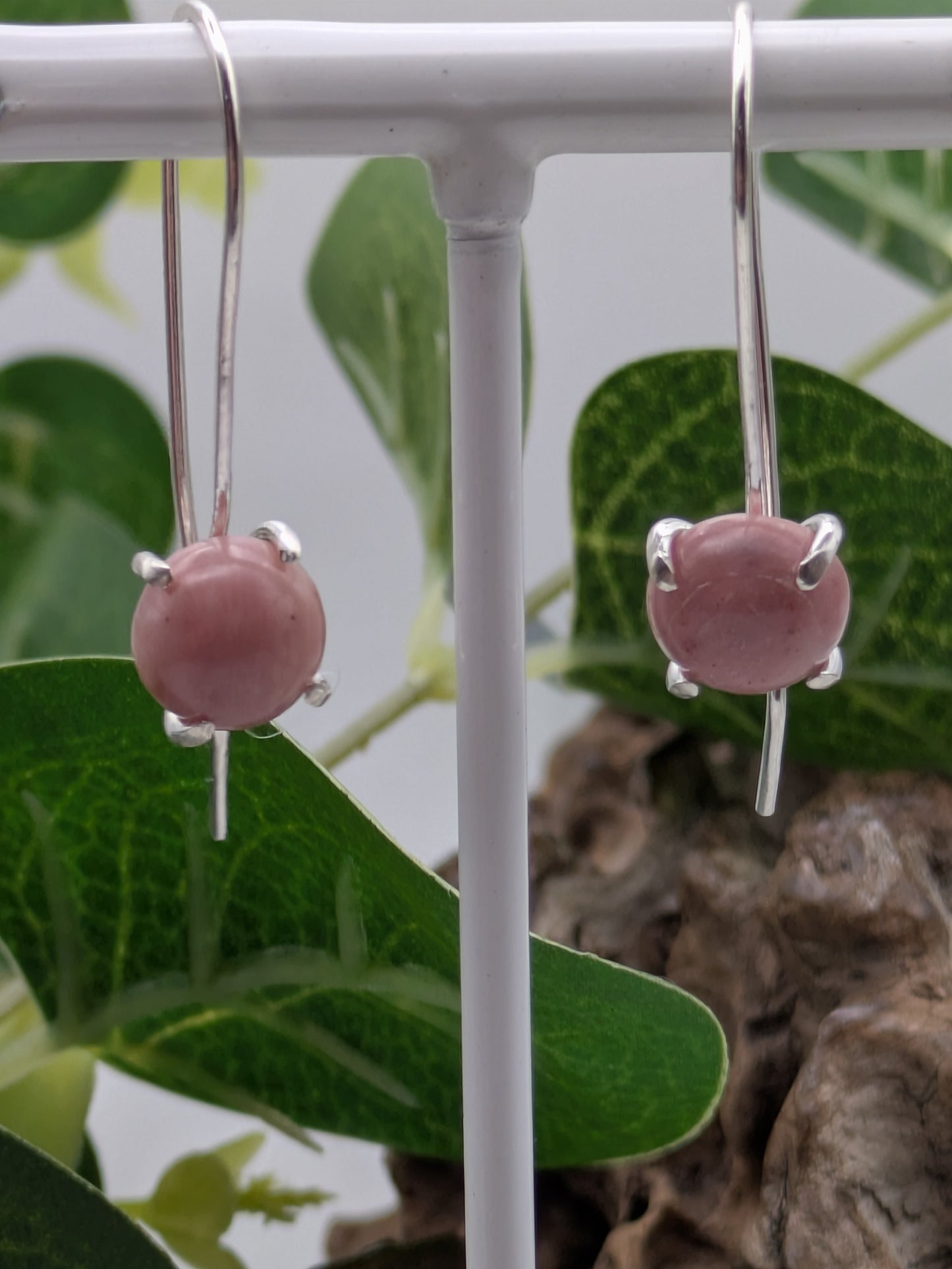 <img src="rhodonite-earrings.jpg" alt="Handmade rhodonite earrings in recycled sterling silver, pink crystal drops for emotional healing and self-love">